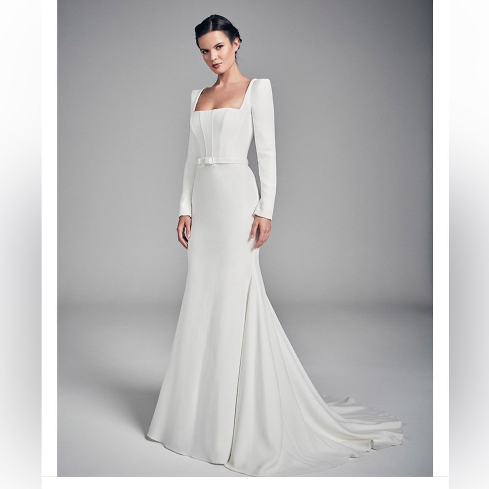 Designer white long sleeved wedding dress